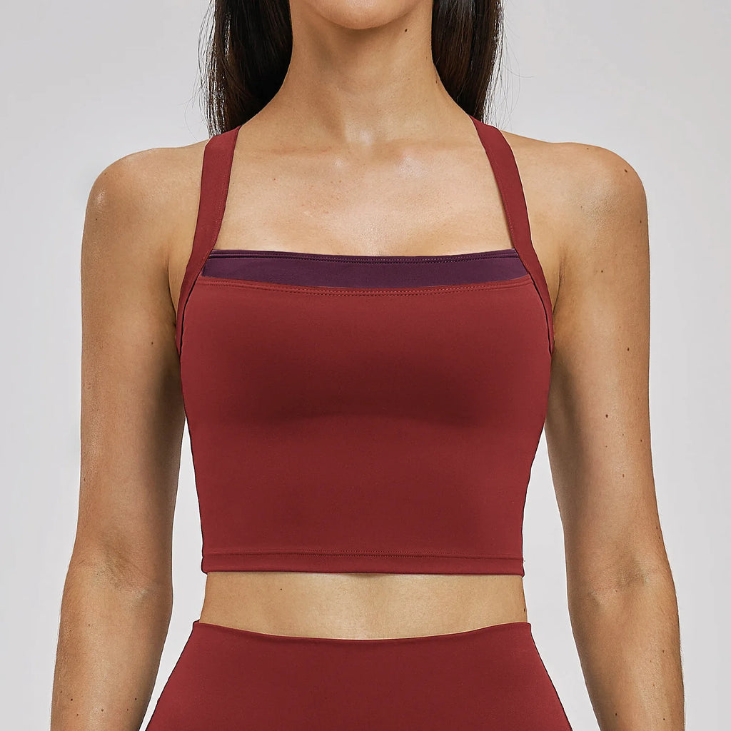 Red sports bra worn by a person on a plain background