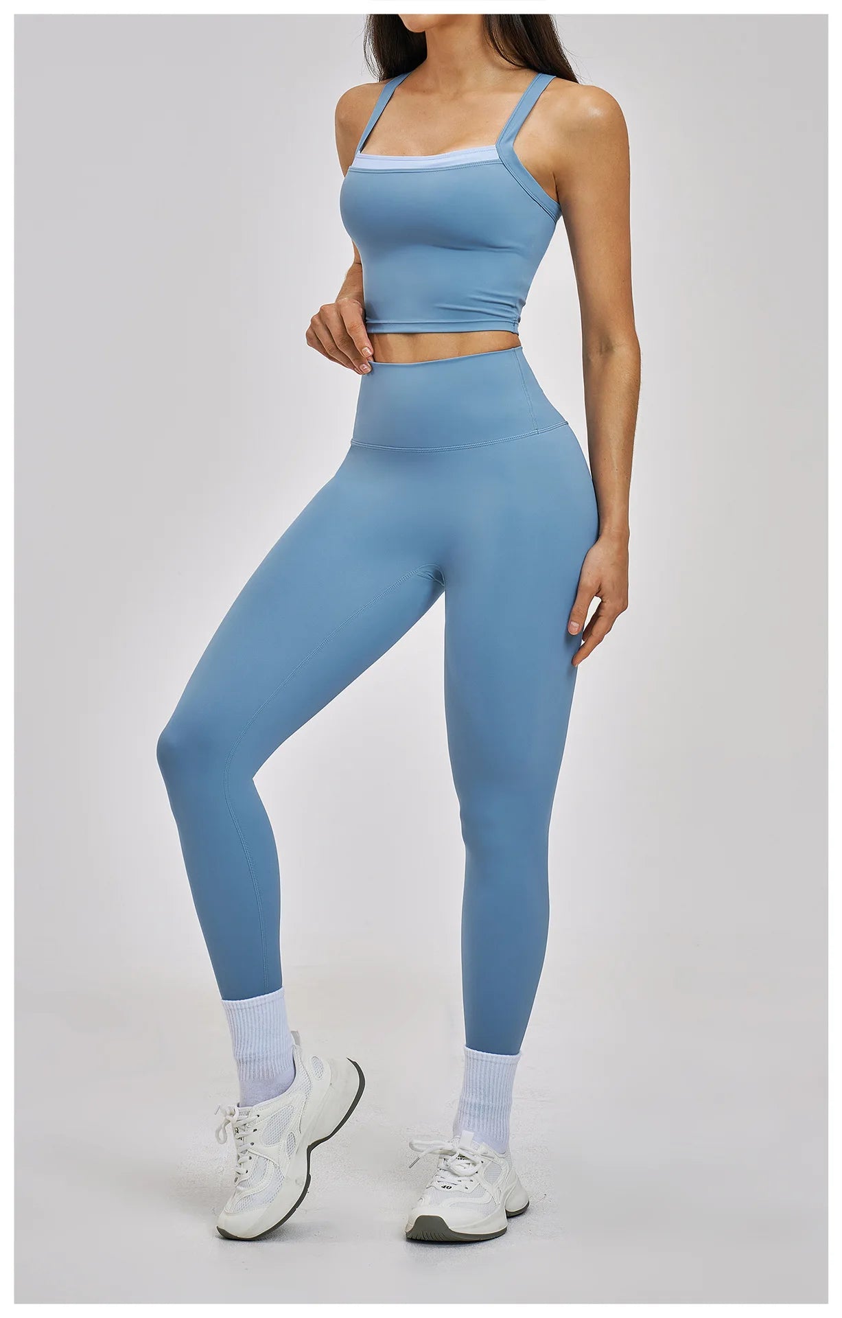 Person wearing a blue athletic outfit on a light gray background