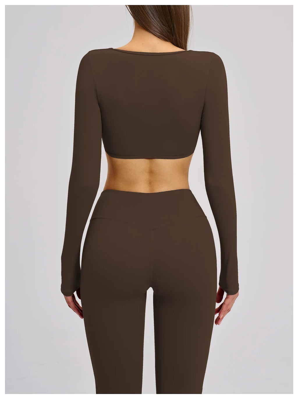 Brown long-sleeve top and leggings set on a plain background