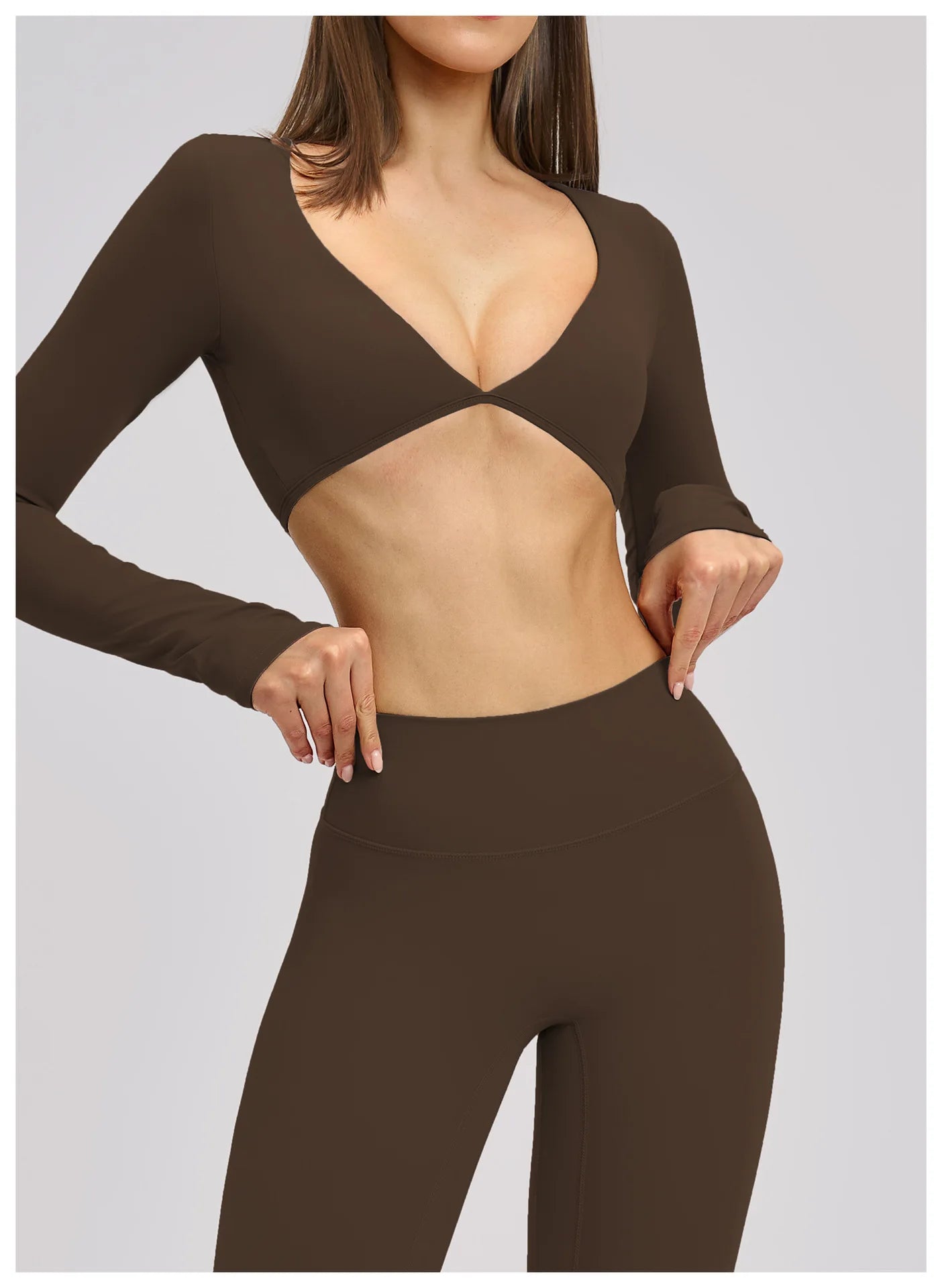 Brown long-sleeve top and leggings set on a plain background