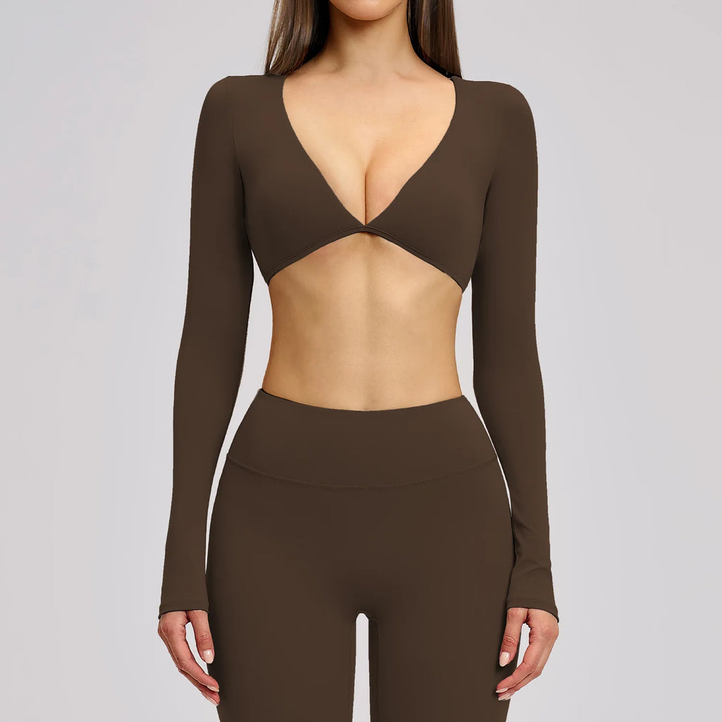 Brown long-sleeve top and leggings set on a plain background