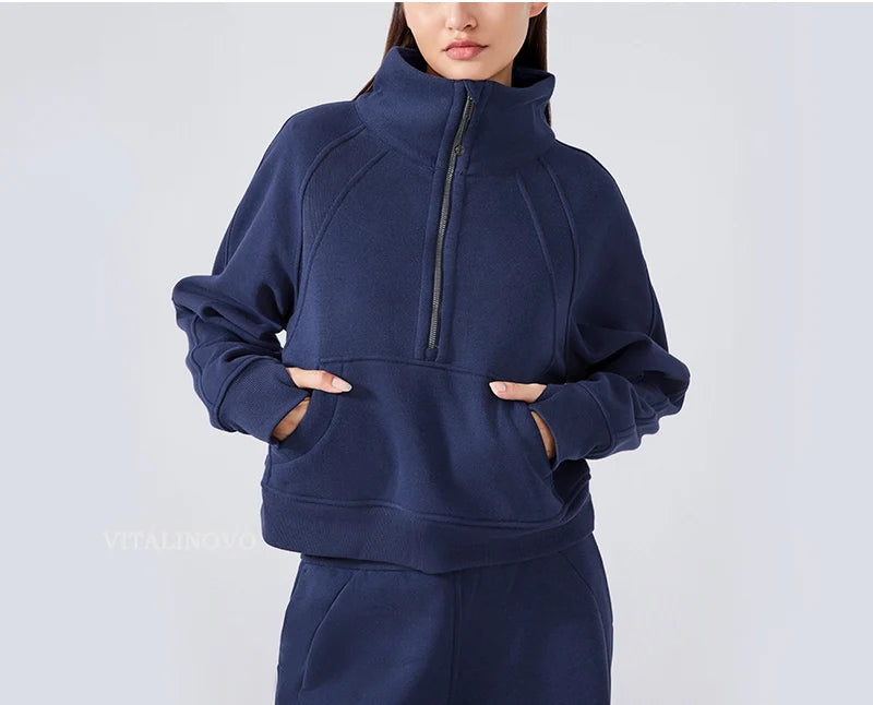 Navy blue hoodie with a high collar and front zipper on a white background