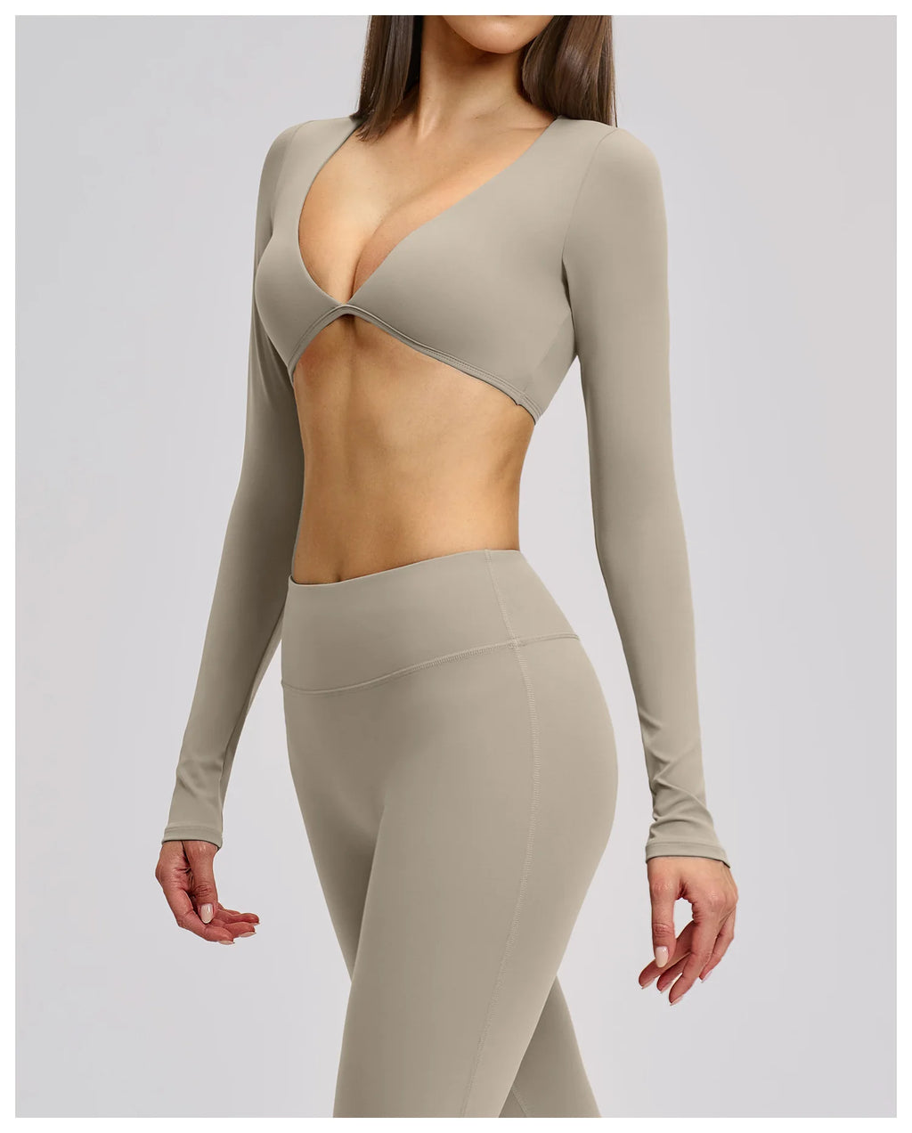 Beige long-sleeve top and leggings set on a plain background
