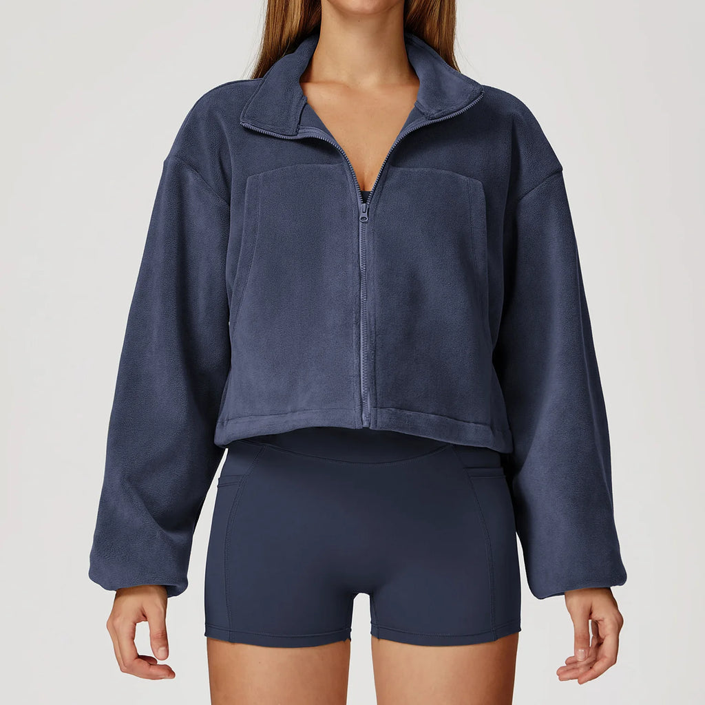 Navy blue fleece jacket and shorts set on a plain background