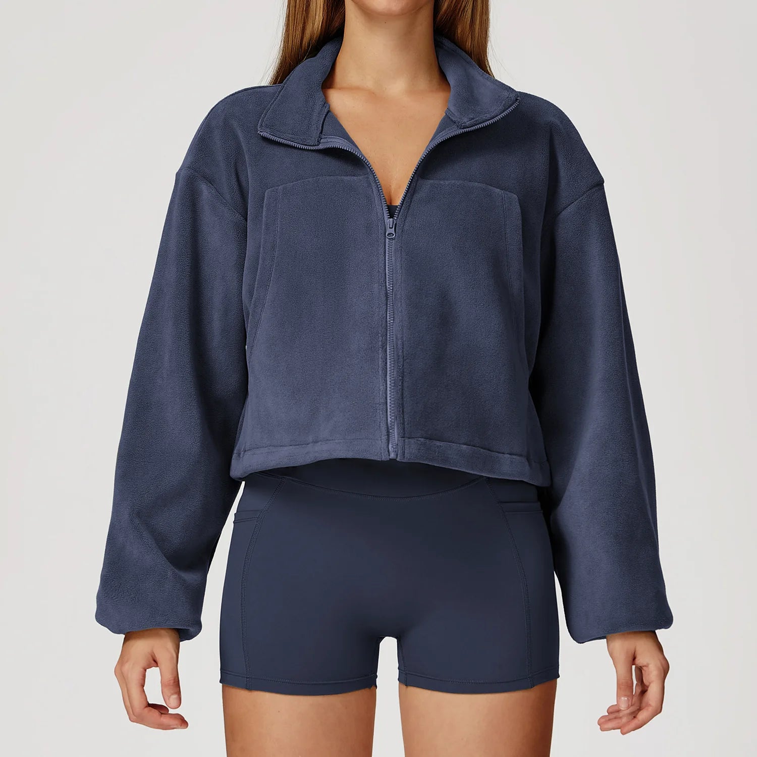 Navy blue fleece jacket and shorts set on a plain background