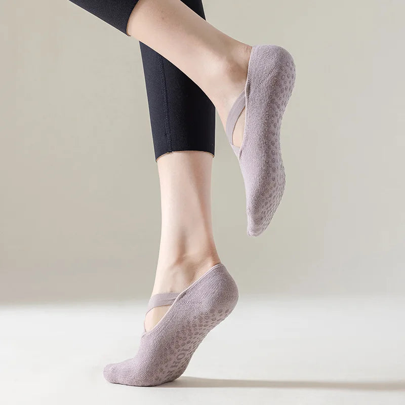 Person wearing light purple socks with a neutral background