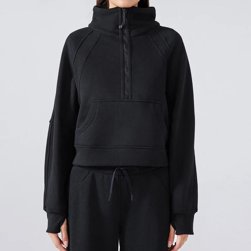 Black half-zip hoodie and pants on a plain background