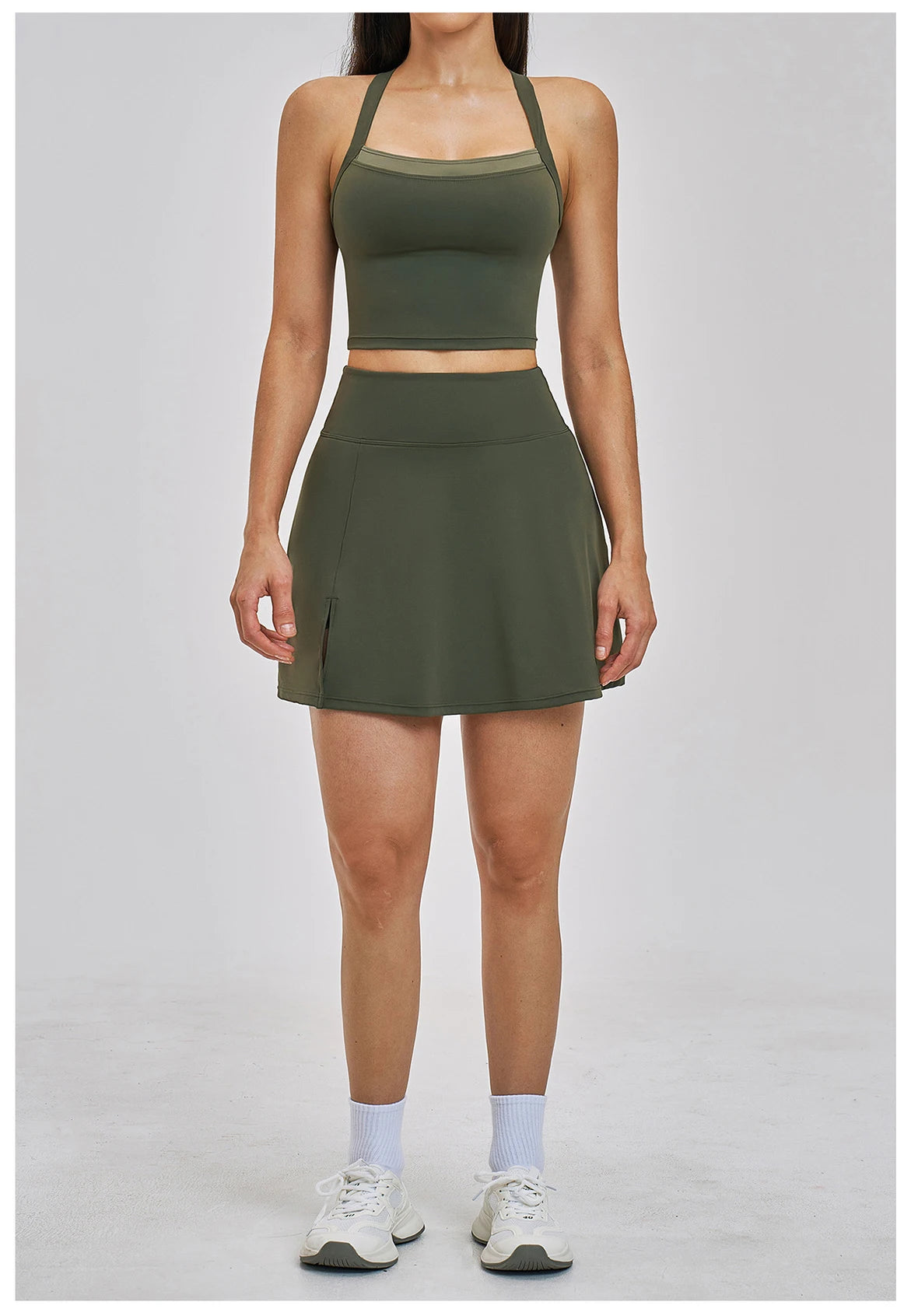 Person wearing a green sports outfit on a plain background