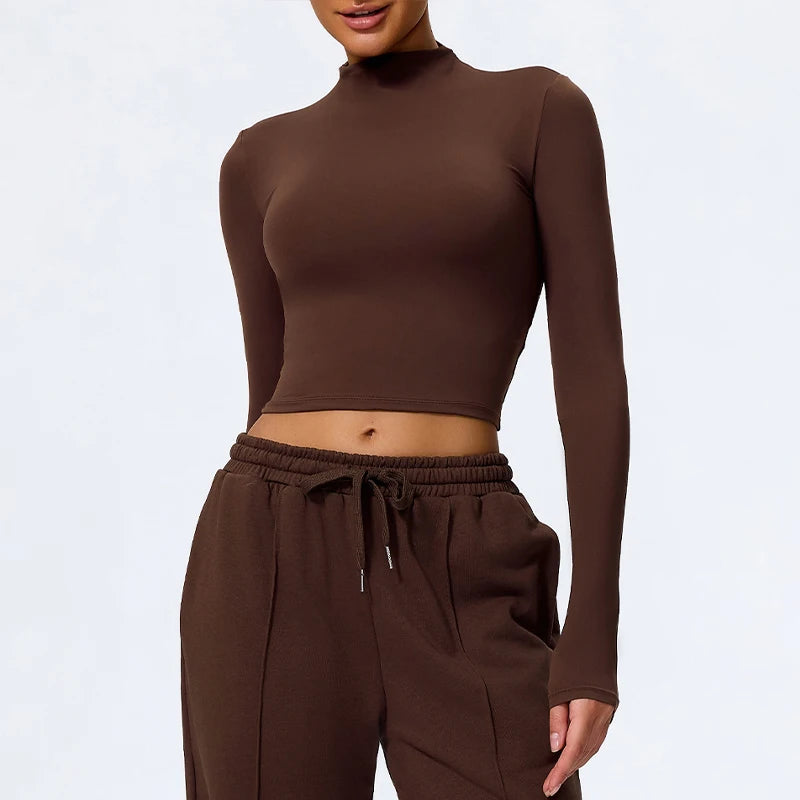 Brown long-sleeve top and pants worn by a person on a white background