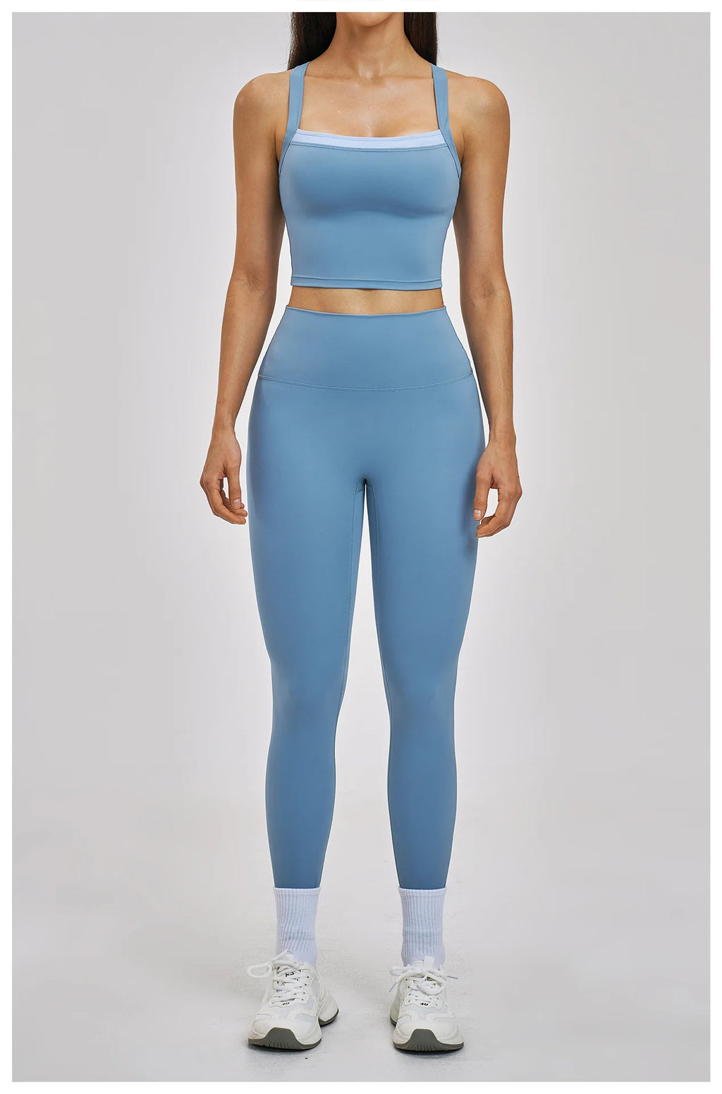Person wearing a blue athletic outfit on a light gray background