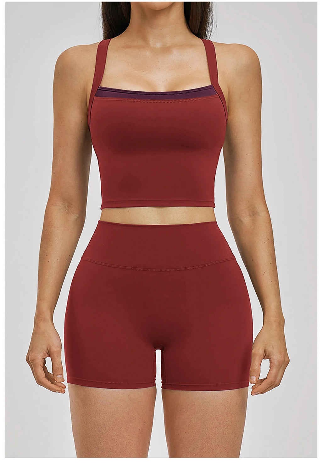 Maroon athletic top and shorts set on a plain background