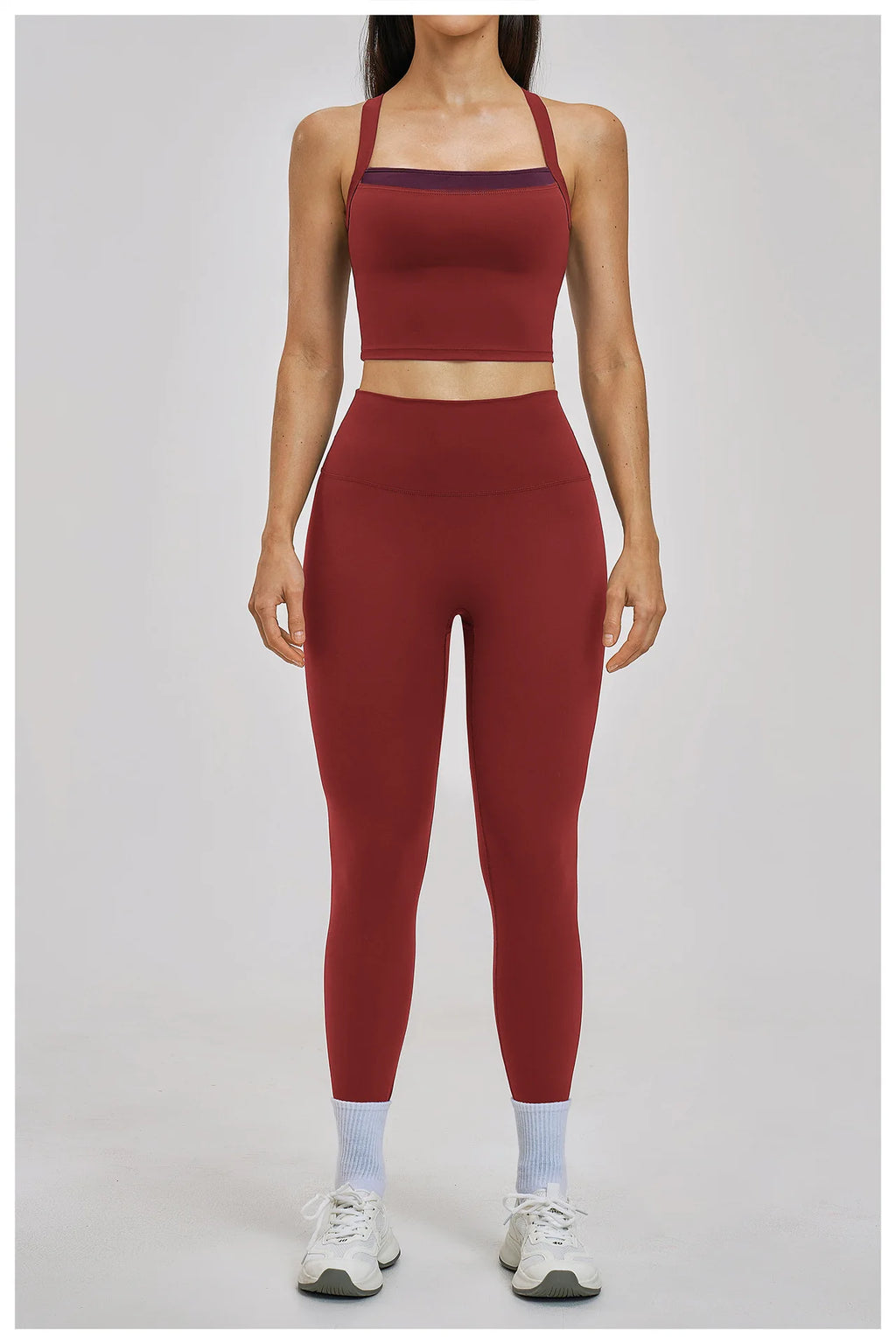 Person wearing a red athletic outfit on a plain background