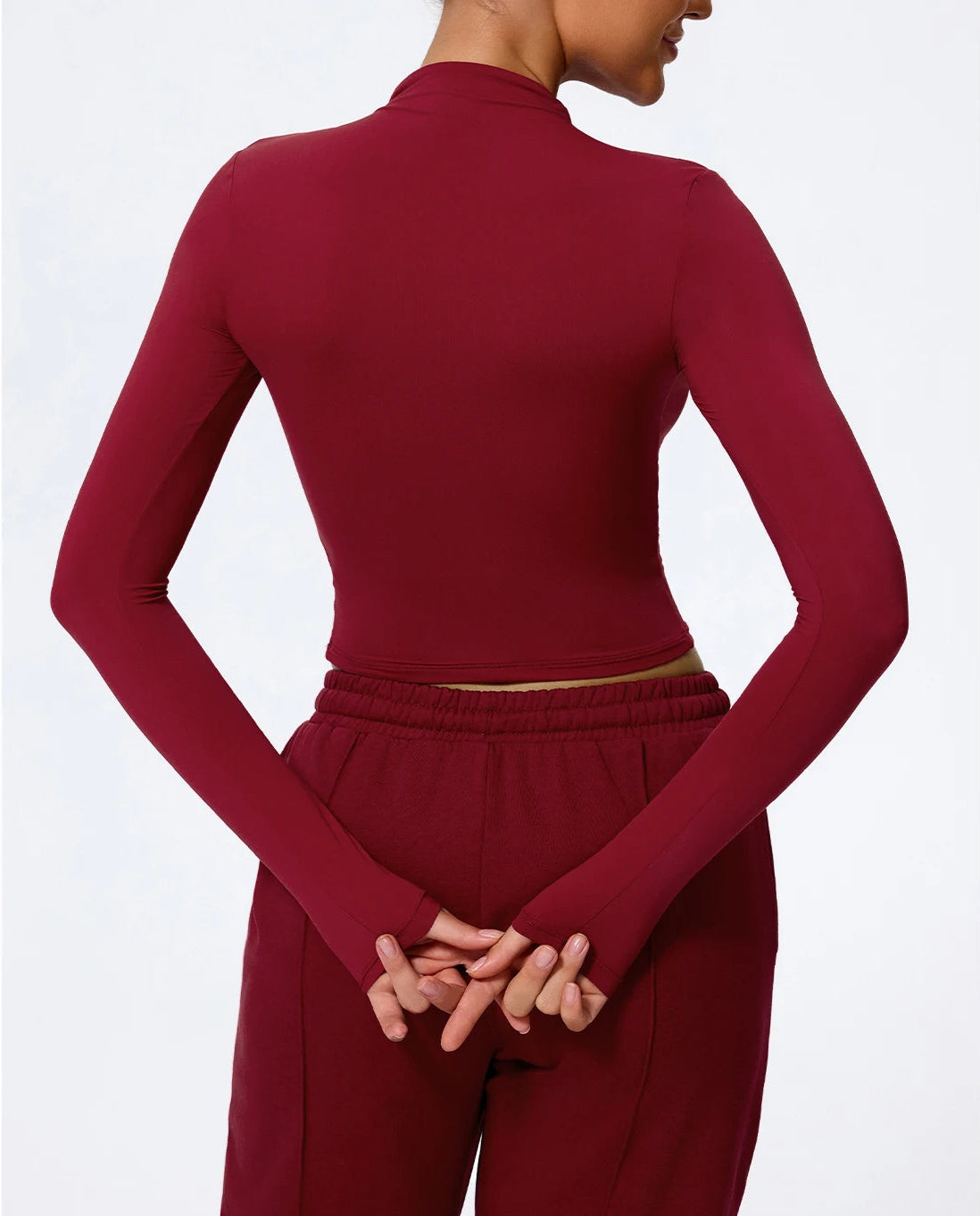 Maroon long-sleeve top and pants on a white background