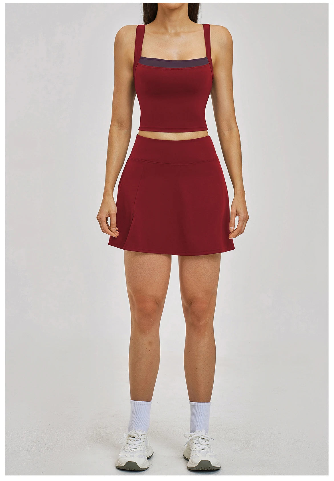 Person wearing a red athletic outfit on a white background