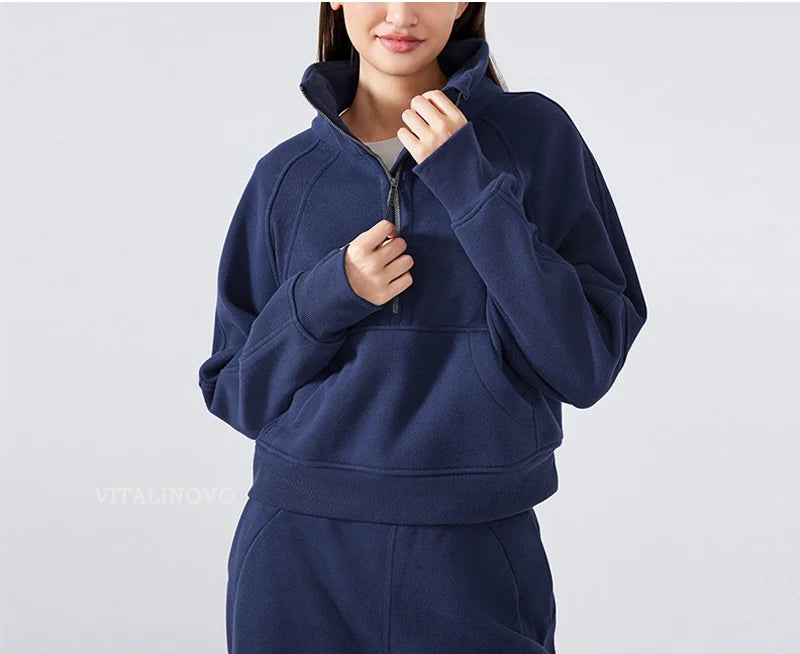 Person wearing a navy blue hoodie on a light gray background