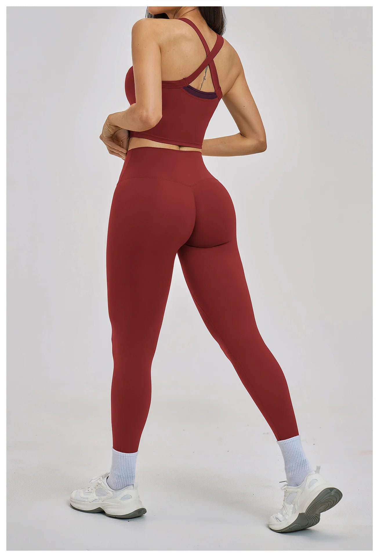 Person wearing a red athletic outfit on a white background