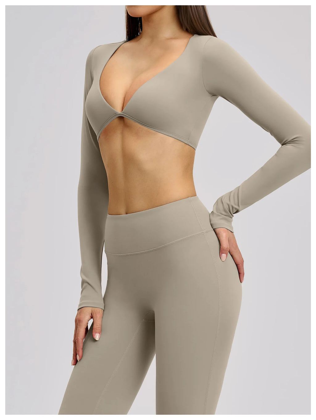 Beige long-sleeve top and leggings set on a plain background