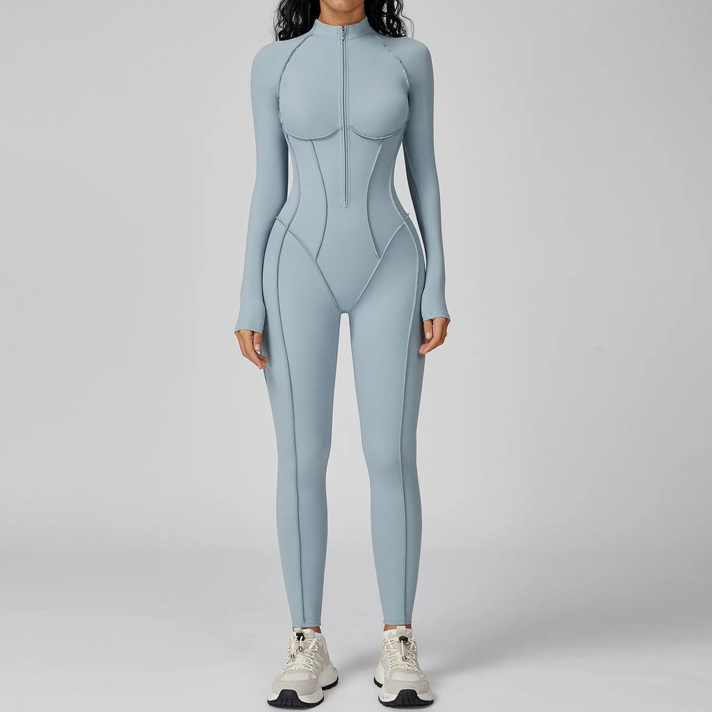 Person wearing a light blue bodysuit on a gray background