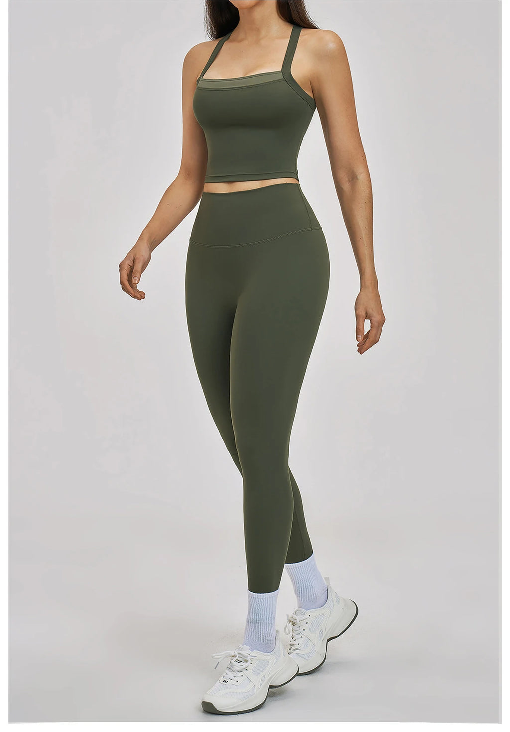 Person wearing a green athletic outfit on a gray background