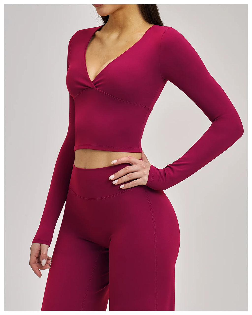 Maroon long-sleeve top and leggings set on a plain background