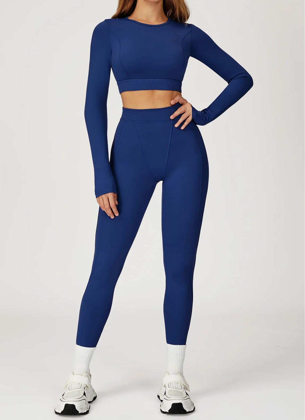 Person wearing a blue athletic outfit on a white background