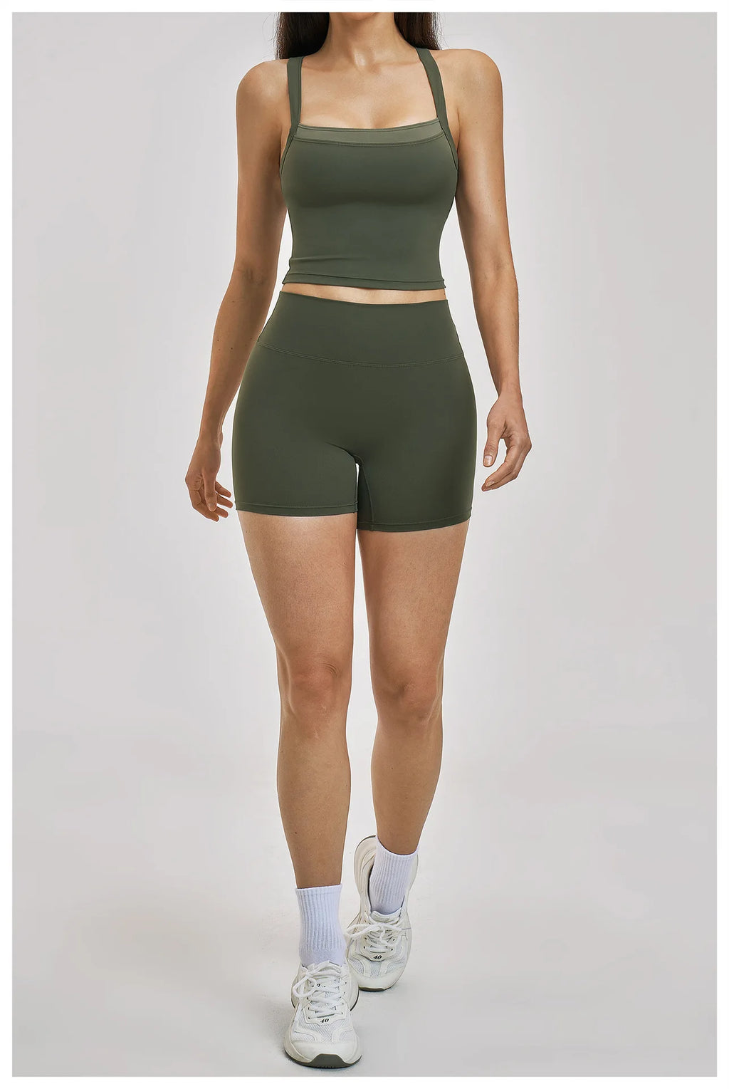 Person wearing a green athletic outfit on a light gray background