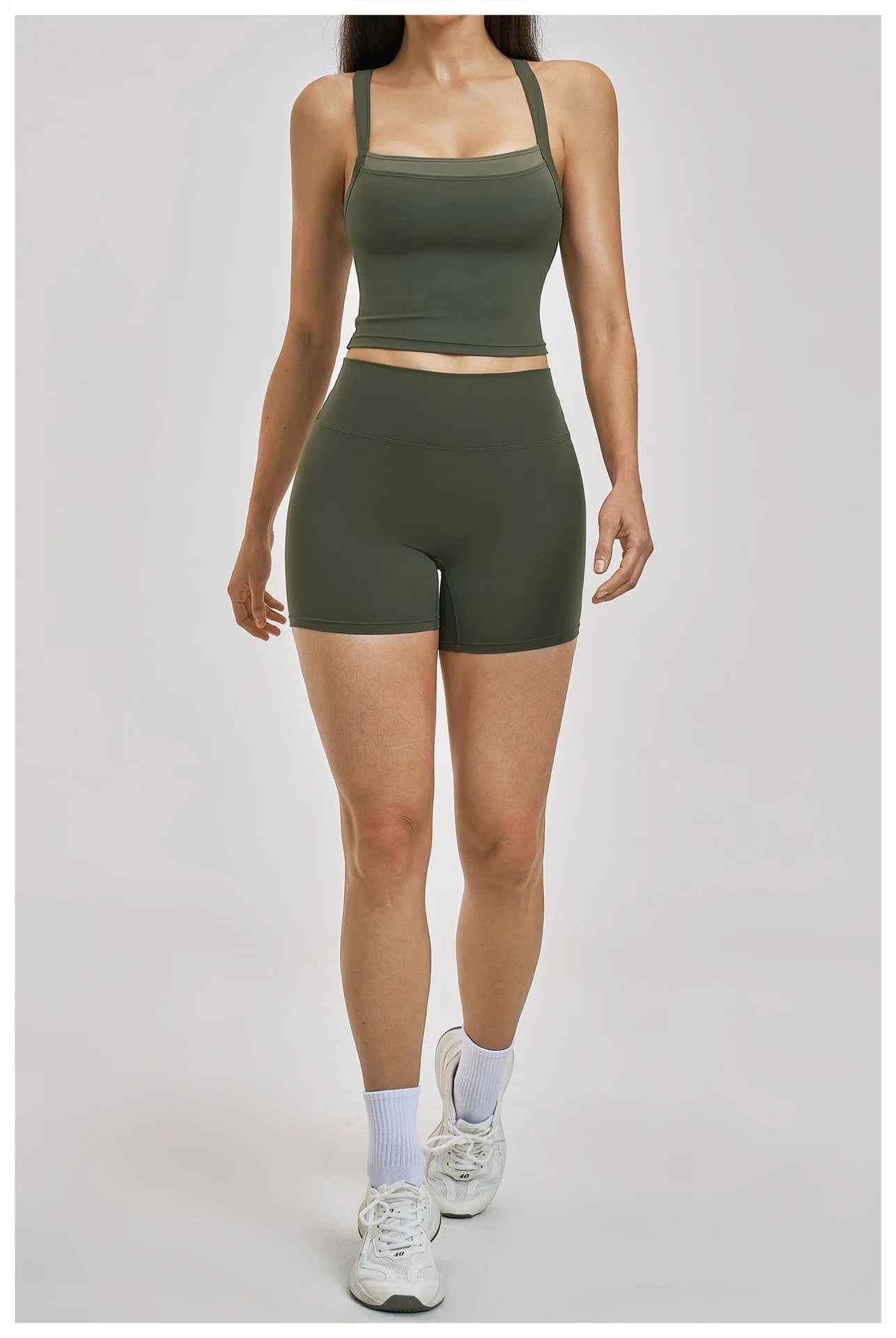 Person wearing a green athletic outfit on a light gray background