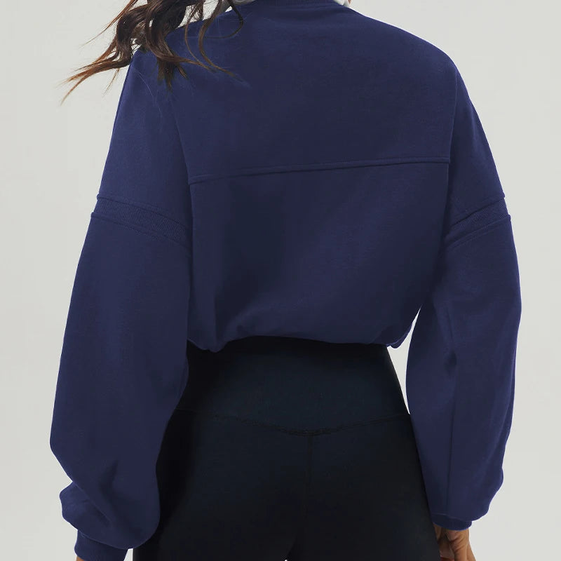 Navy blue sweatshirt worn by a person on a light gray background