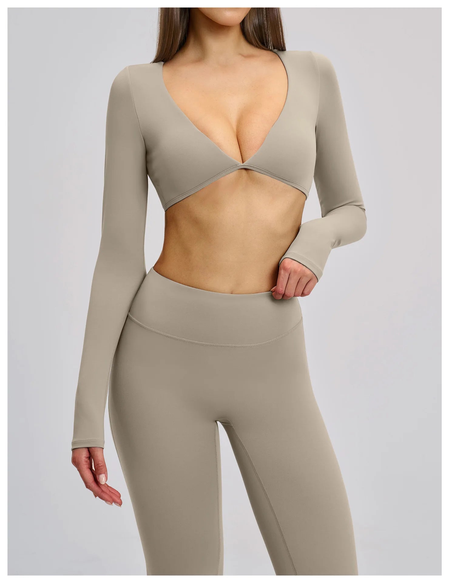 Beige long-sleeve top and leggings set on a plain background