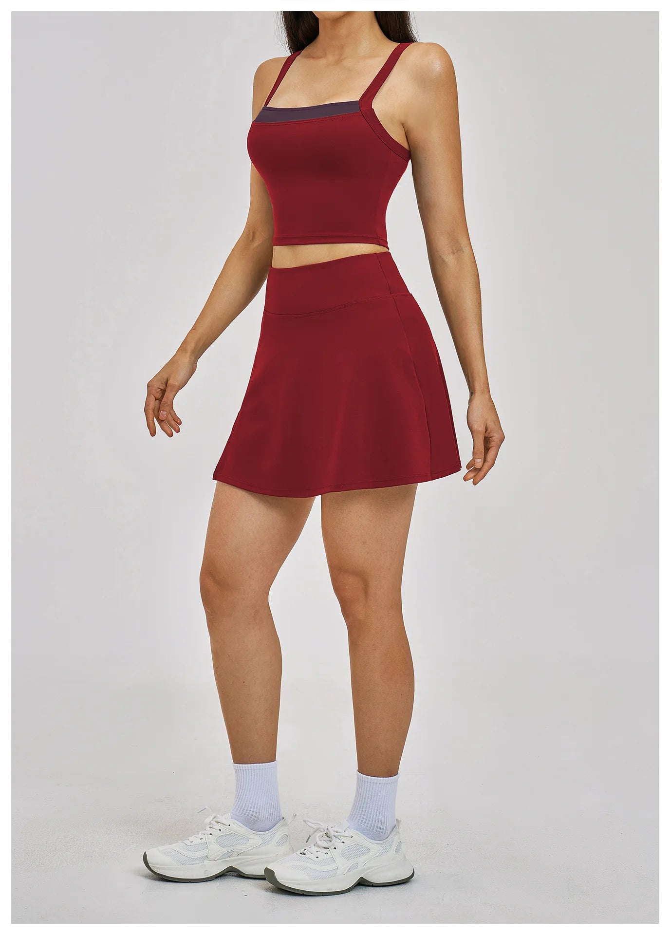Person wearing a red athletic outfit with a white background