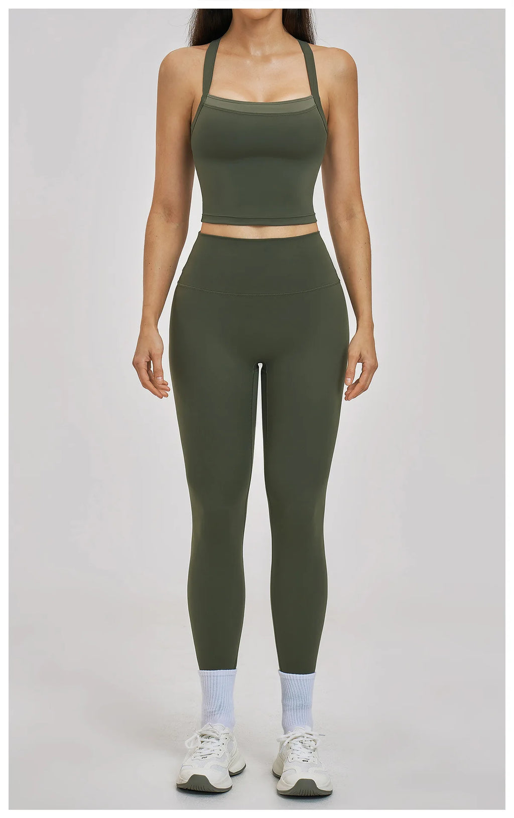 Person wearing a green athletic outfit on a plain background