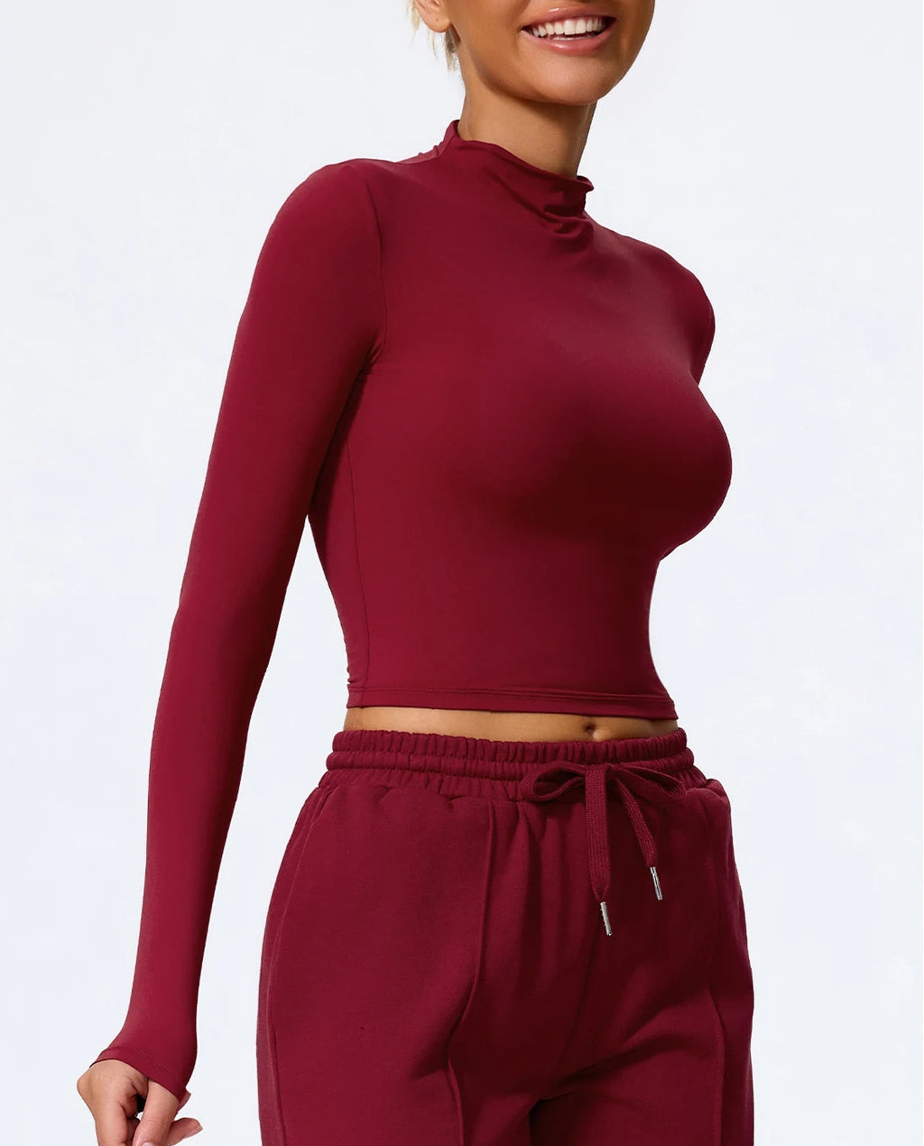 Maroon long-sleeve top and pants set on a white background
