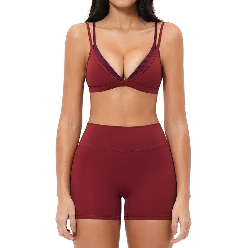 Maroon sports bra and shorts set on a white background
