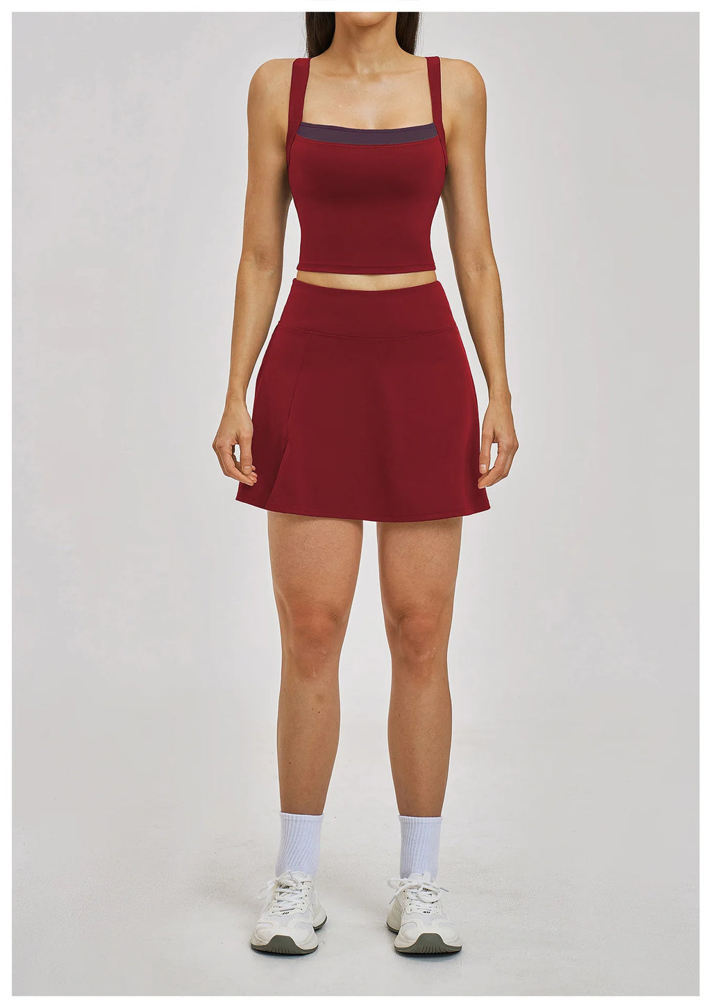 Person wearing a red athletic outfit on a white background
